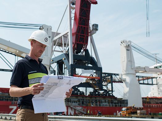 Man reading construction papers